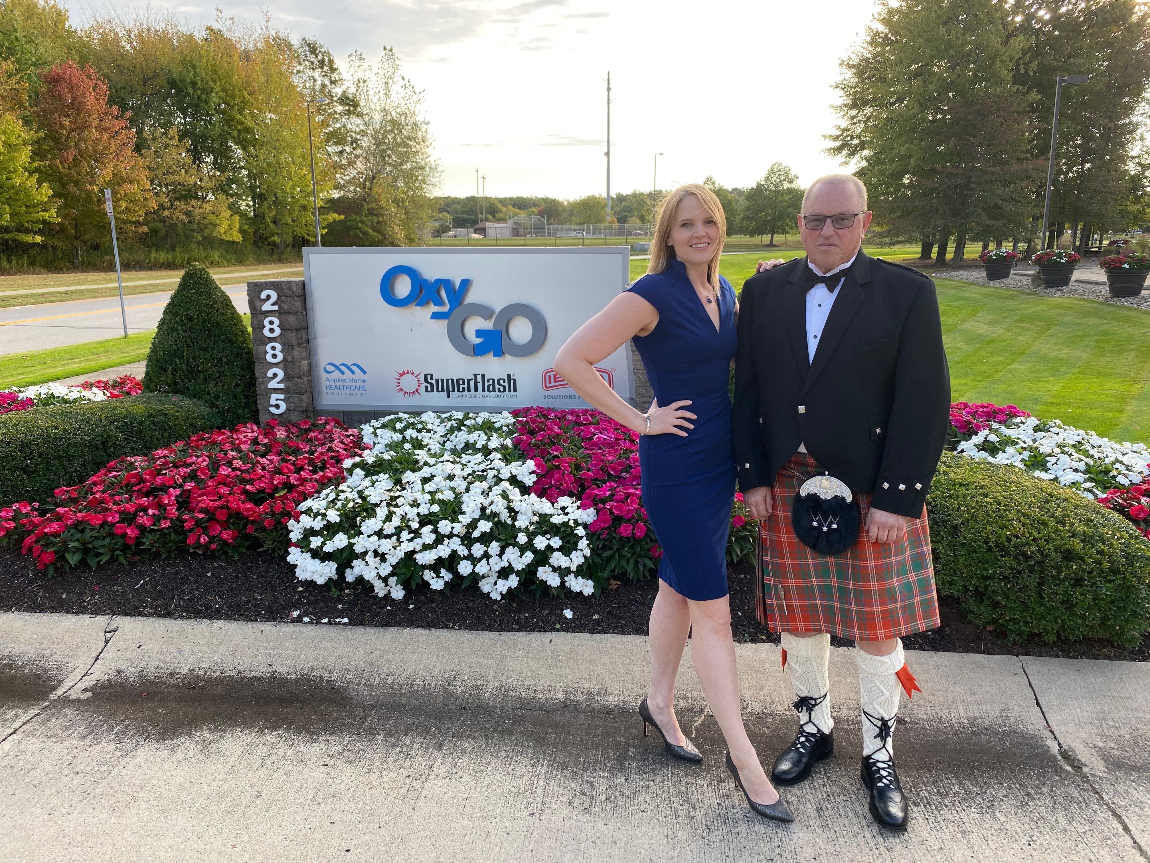 OxyGo CEO Victoria Marquard Schultz and OxyGo Owner Dave Marquard in front of the OxyGo sign.